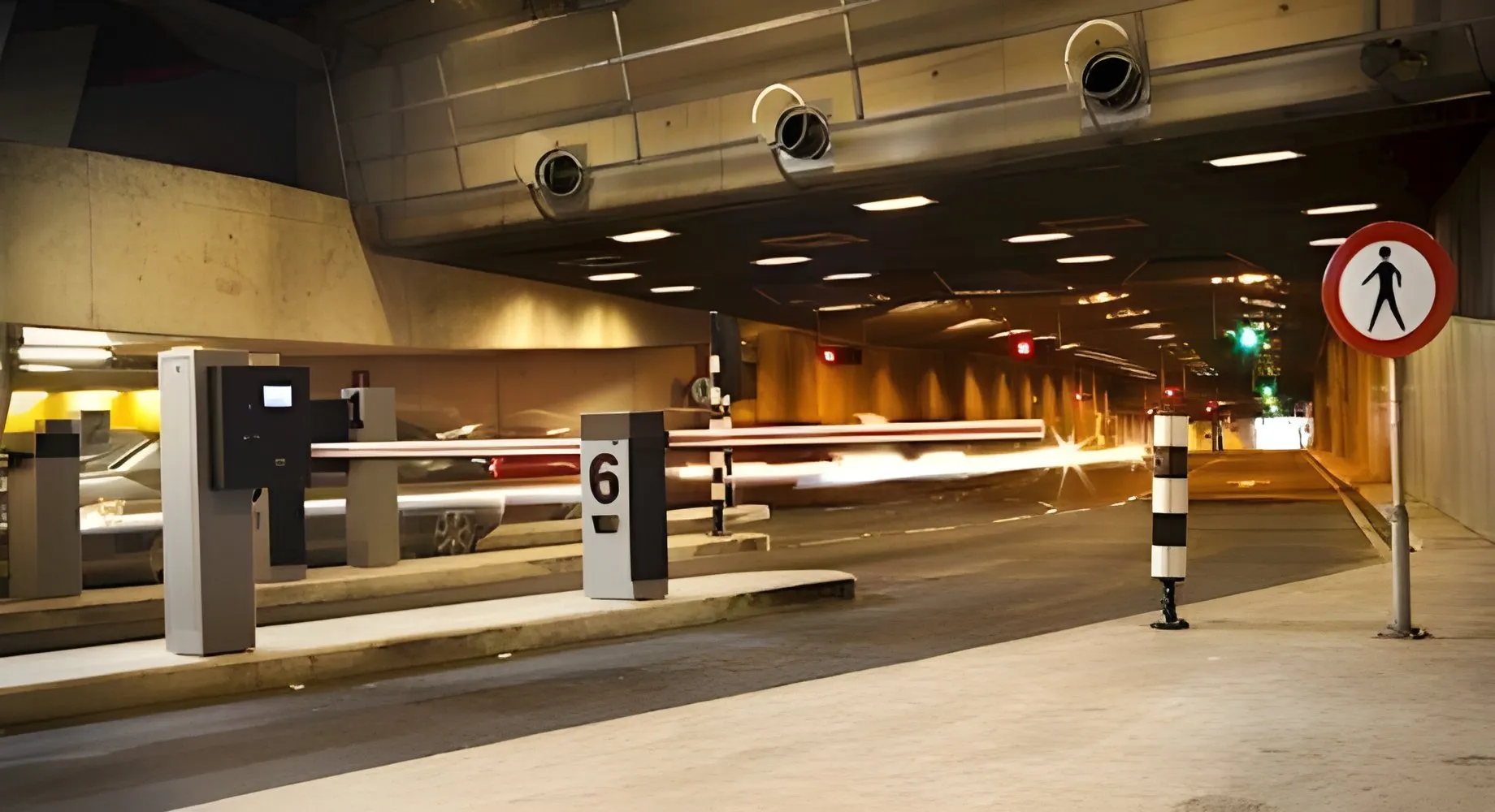 Number plate recognition camera beside a car park barrier